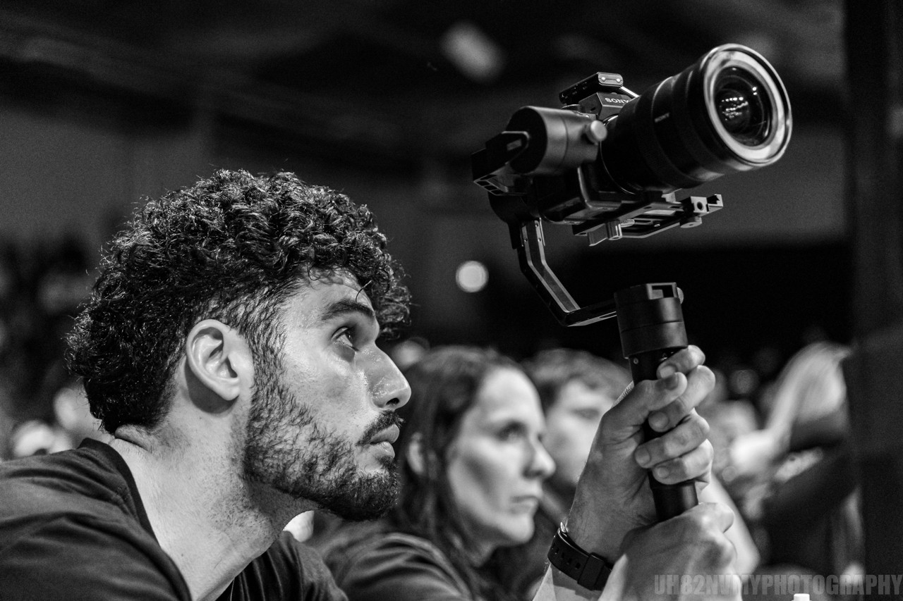STGM owner filming an event with a gimbal camera rig